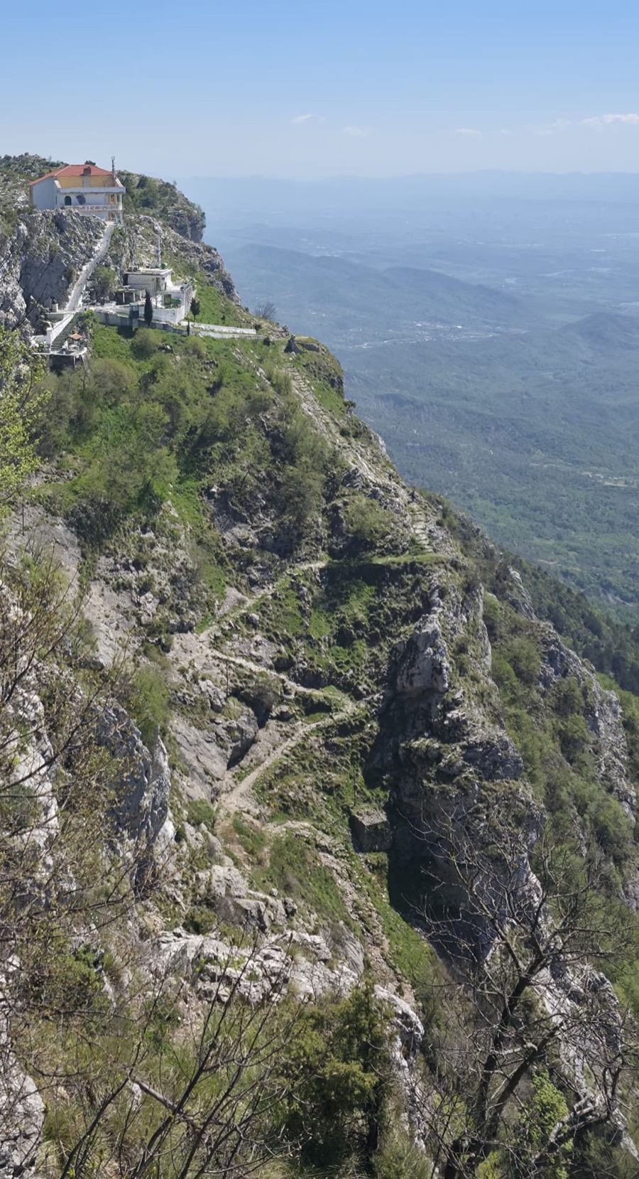 The Temple of Sari Salltik perched on the cliff edge at 1,176m, reached by a switchback trail