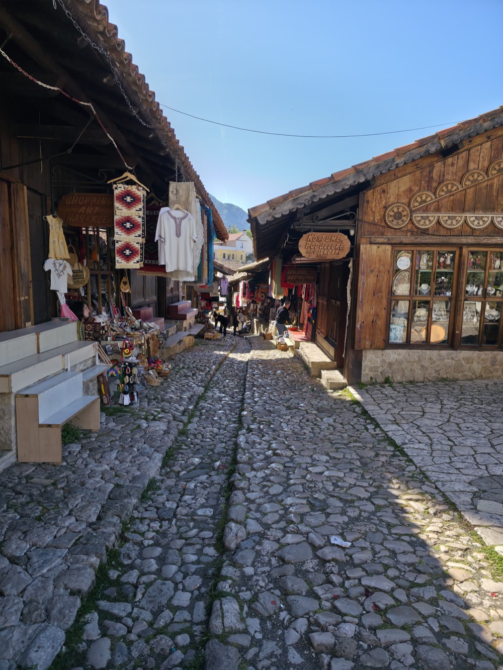 The cobbled Old Bazaar street of Krujë — The Pilgrimage tour